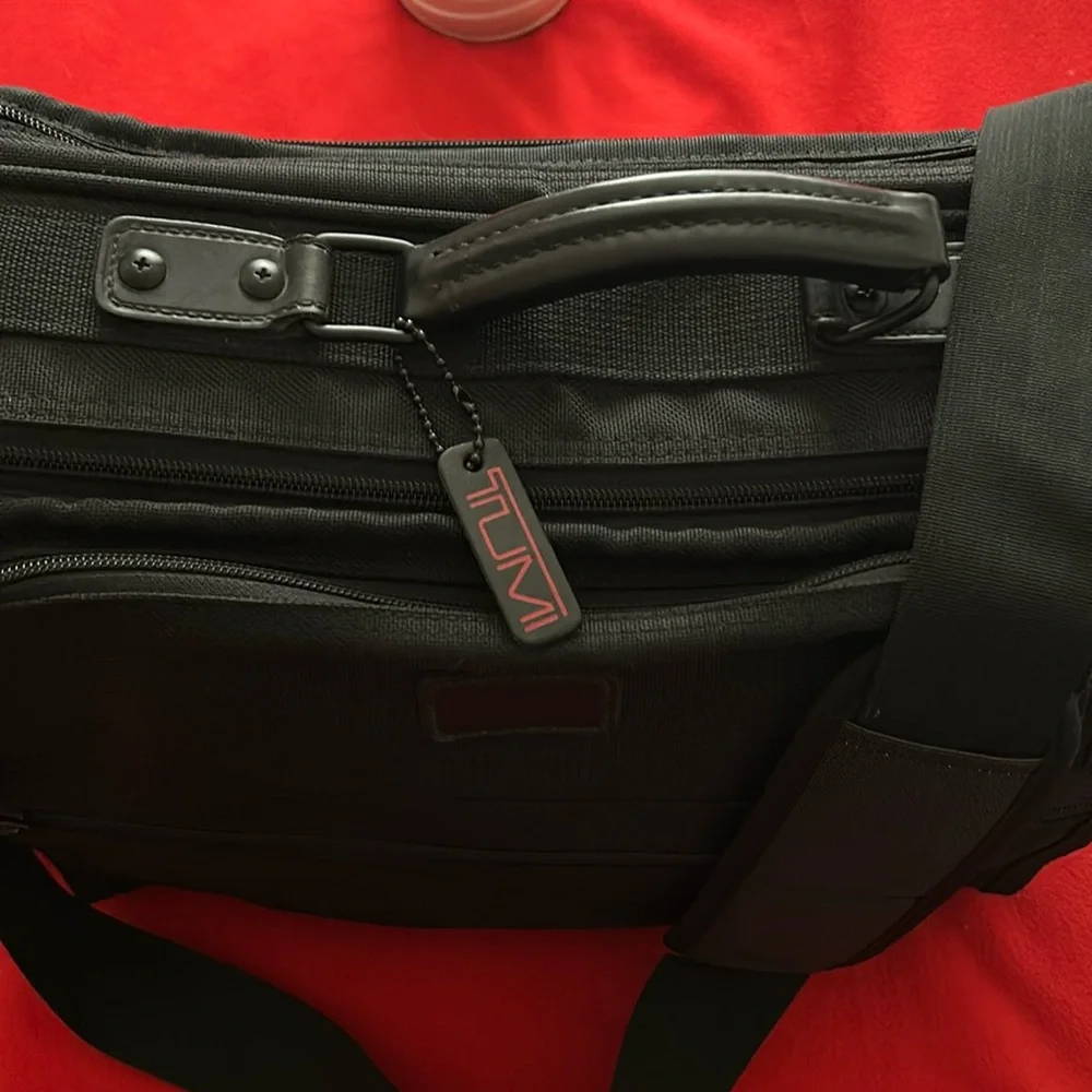 Tumi Black brief case/messenger bag